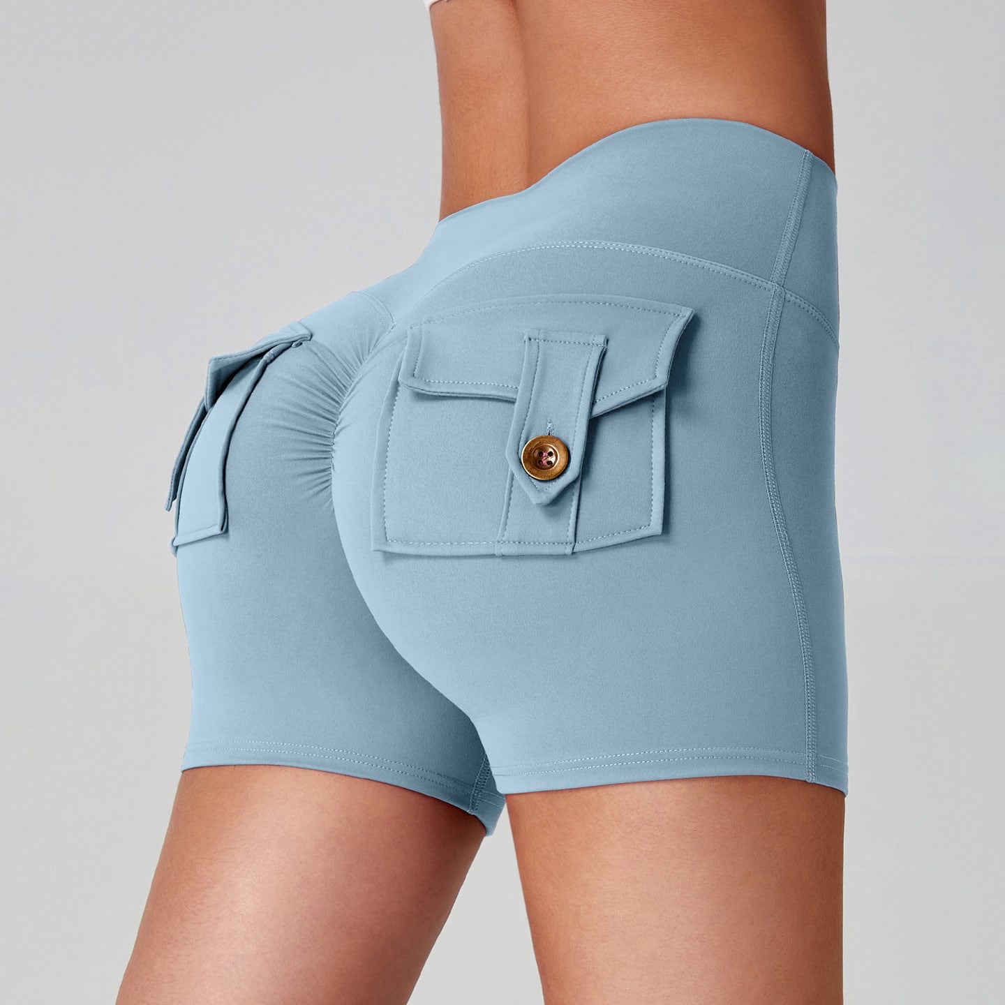 Women quick dry running leggings in light blue with stylish back pockets, designed for comfort and performance.